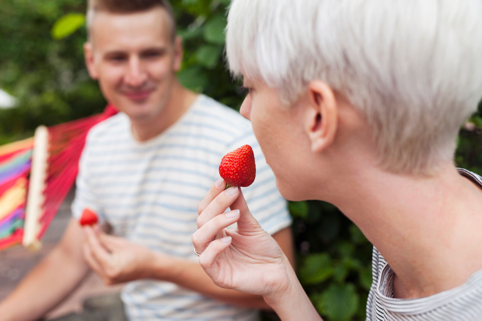 2 people eating strawberries - Extraordinary Berries Co.